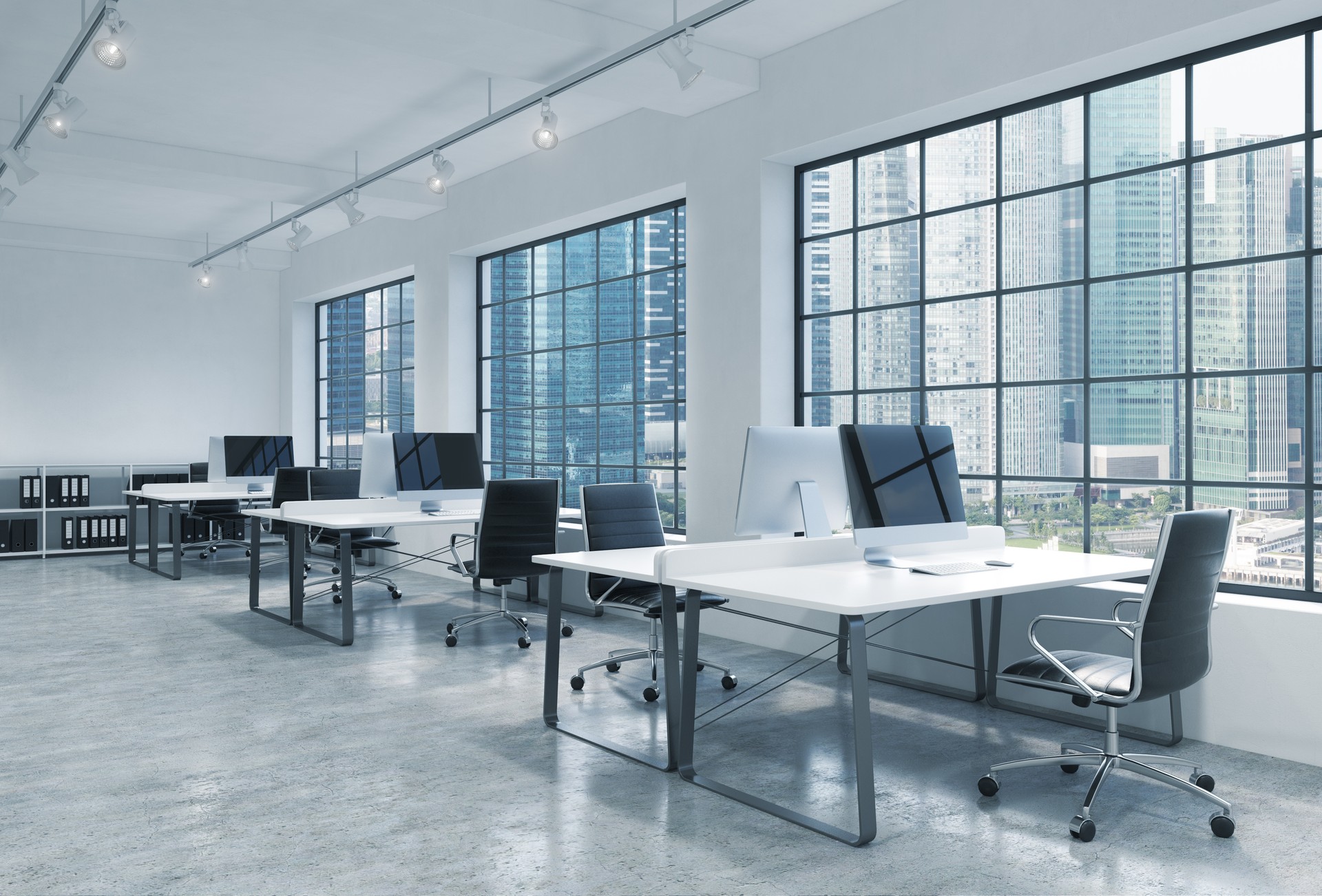 Workplaces in a bright modern loft open space office. Singapore